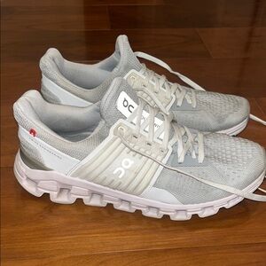 On Running Light Gray and White Athletic Shoes
